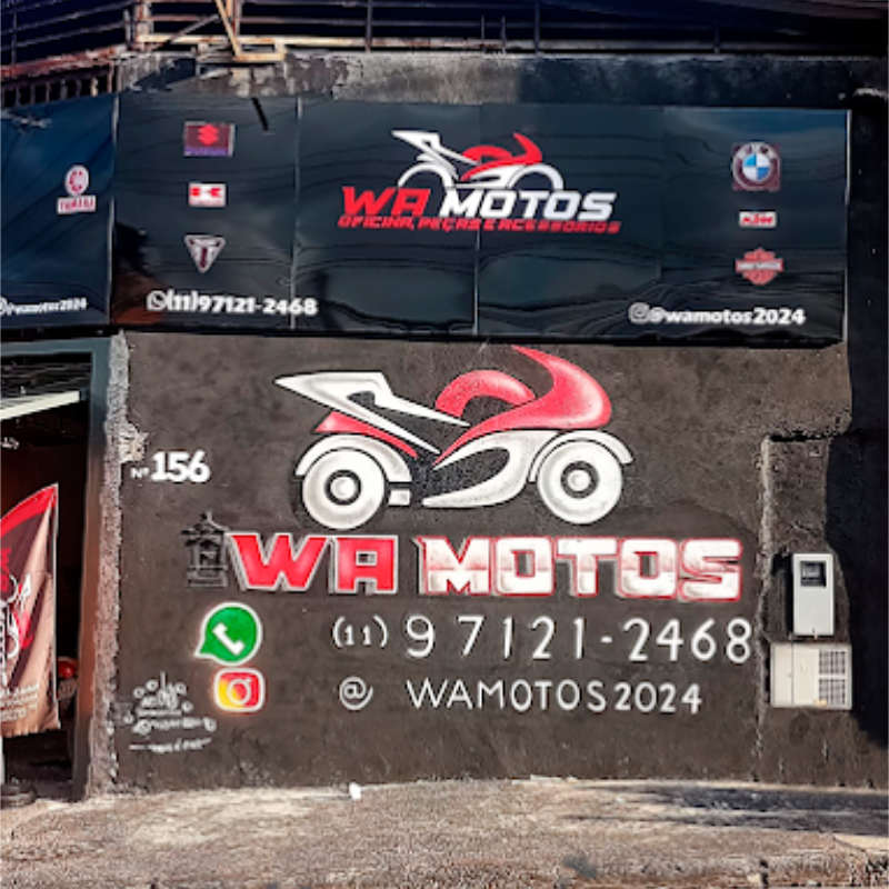 Fachada da loja WA Motos com placa de identificação, serviços e contatos de motopeças e mecânica em Carapicuíba